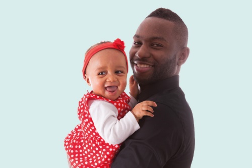 dad holding baby girl